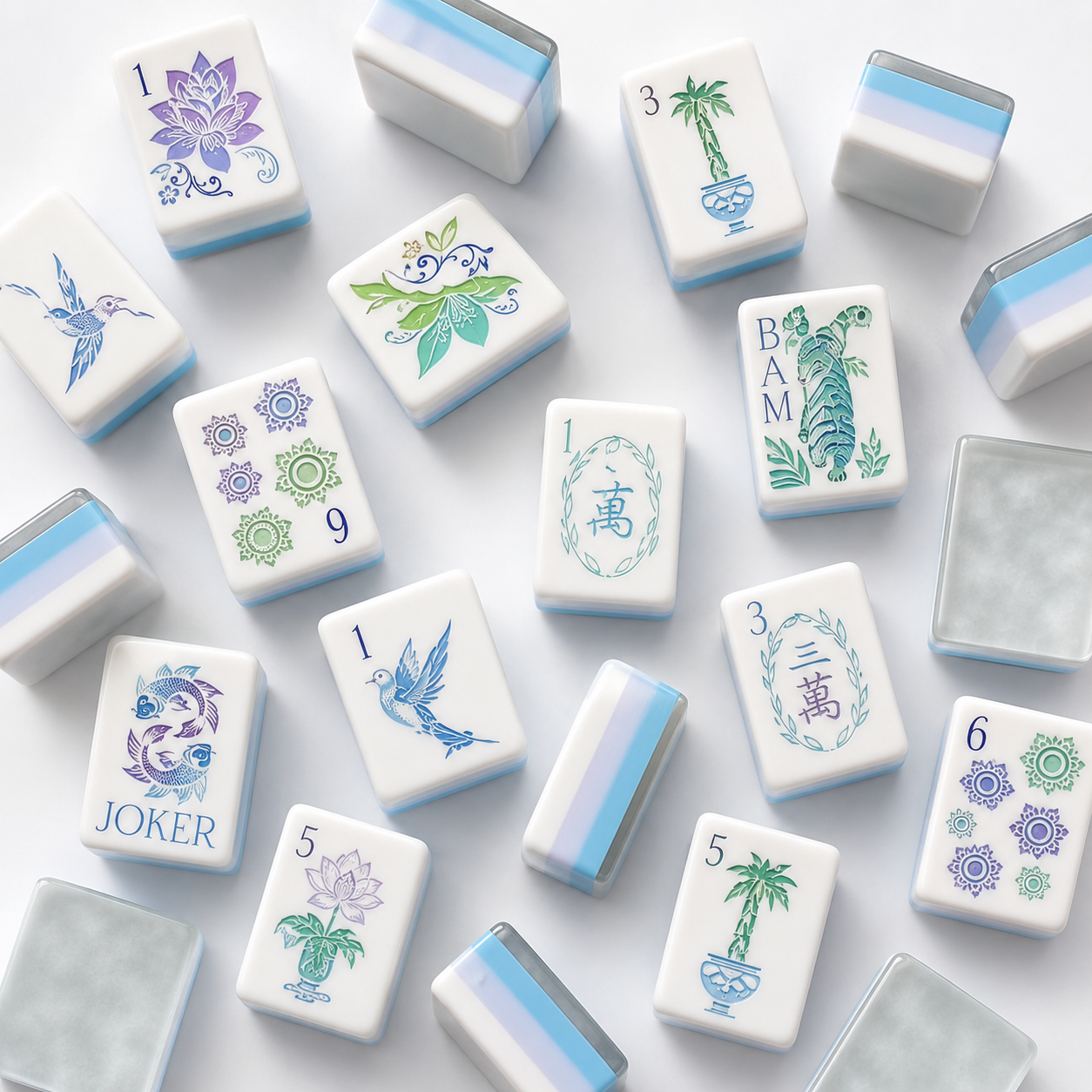 Set of decorative mahjong tiles with various designs on a light background