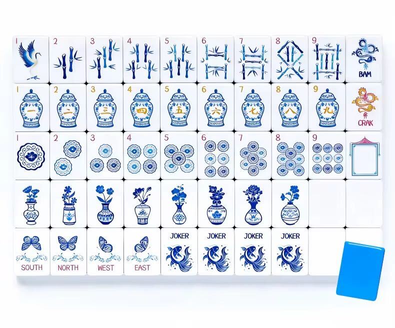 Close-up of American Mahjong tiles with porcelain vase and bamboo artwork