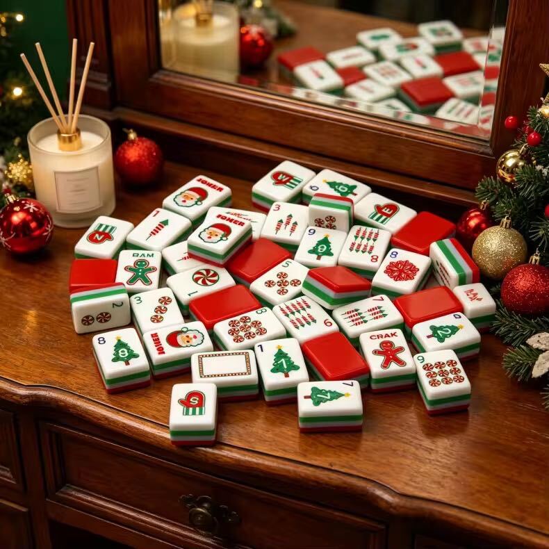 A Christmas-themed mahjong tile set for holiday game nights, festive gifting, and seasonal display. The red, green, and white layered tiles include Christmas trees, candy canes, Santa-style jokers, and other holiday details.