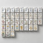 Luxury acrylic Mahjong tiles with pearl finish, gold details, and colorful jewel accents