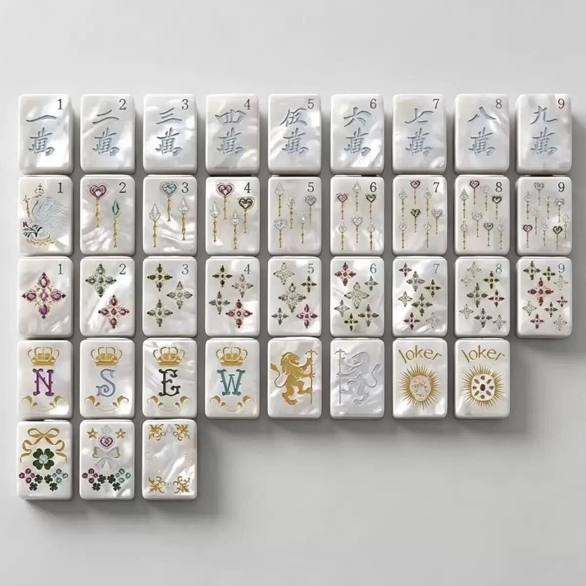 Luxury acrylic Mahjong tiles with pearl finish, gold details, and colorful jewel accents